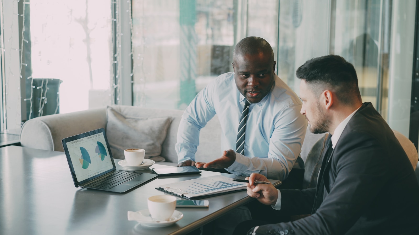 Team reviewing analytical reports in a meeting room